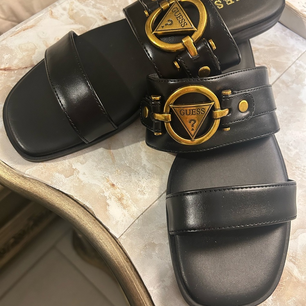 Guess Woman’s Black Slides with Gold Buckles